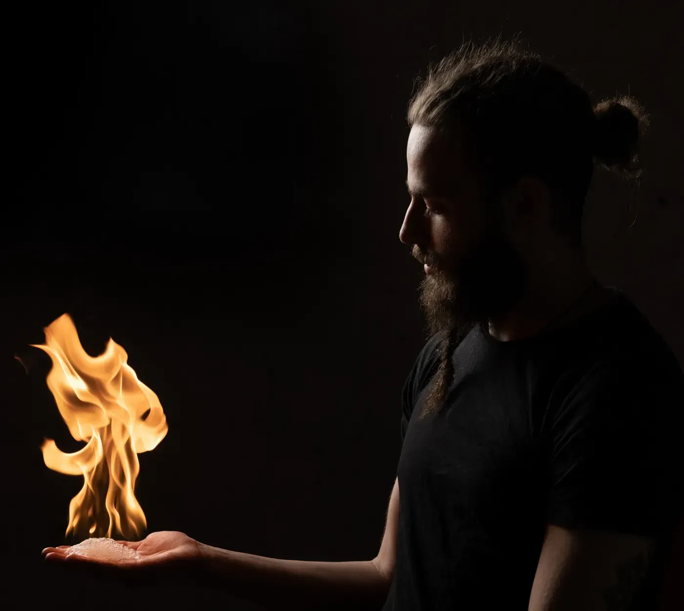 Lior Littman holding a flame in his palm